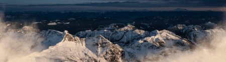 Photo for Dramatic Canadian Rocky Mountains covered in Snow. Aerial Landscape Nature Background. Near Vancouver, British Columbia, Canada. - Royalty Free Image