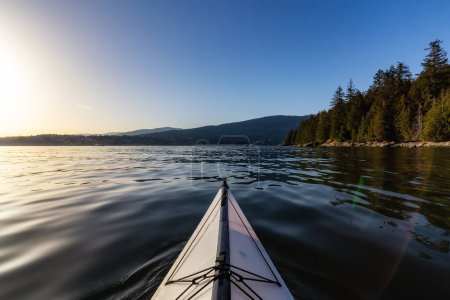 Photo for Kayaking in Indian Arm near Belcarra, Vancouver, BC, Canada. Sunny Sunset. Adventure Travel Concept - Royalty Free Image