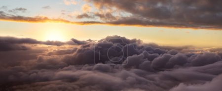Photo for Dramatic Cloudscape Aerial View. Sunset Sky Art Render. Nature Background Panorama. Taken over the mountains in British Columbia, Canada. - Royalty Free Image
