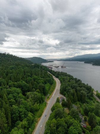 Photo for Aerial View of a Highway in City. Cloudy Sky. Port Moody, Vancouver, BC, Canada. - Royalty Free Image