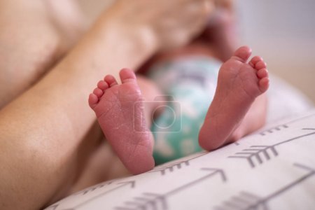 Photo for Infant Small Feet Close Up. Baby on mother lap - Royalty Free Image