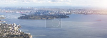 Photo for Stanley Park, Lions Gate Bridge and Downtown City on West Coast of Pacific Ocean. Aerial. Vancouver, British Columbia, Canada. - Royalty Free Image