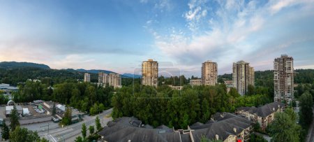 Photo for Residential Neighborhood and Apartment Buildings in Suburban City. Port Moody, Vancouver, BC, Canada. Aerial. Sunset Sky - Royalty Free Image