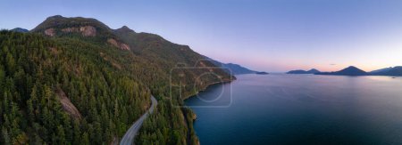 Photo for Sea to Sky Highway on Pacific Ocean West Coast. Aerial Panorama. Sunny Colorful Sunset. Located in Howe Sound between Vancouver and Squamish, British Columbia, Canada. - Royalty Free Image