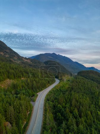 Photo for Scenic Highway on the ocean coast with mountain landscape. Sea to Sky Hwy, North of Vancouver, BC, Canada. Aerial view. Sunset - Royalty Free Image