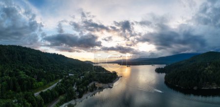Photo for Aerial View of a Highway in City. Cloudy Sunset Sky. Port Moody, Vancouver, BC, Canada. Panorama - Royalty Free Image