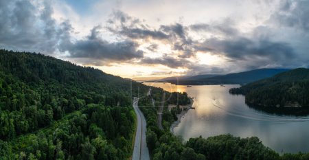 Photo for Aerial View of a Highway in City. Cloudy Sunset Sky. Port Moody, Vancouver, BC, Canada. Panorama - Royalty Free Image