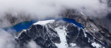 Photo for Rocky Mountain Peak and Glacier Lake. Aerial Landscape Nature Background. View from Airplane, Washington, USA. - Royalty Free Image