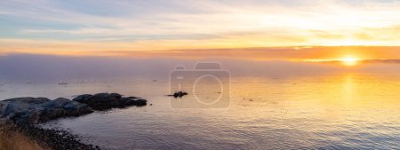 Photo for Rocky Shore on the Pacific Ocean Coast. Foggy Sunset. Victoria, Vancouver Island, BC, Canada. Nature Background. - Royalty Free Image