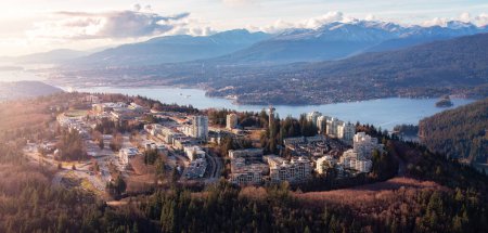 Photo for Buildings and Homes on Burnaby Mountain. Aerial Panorama. Sunset. Vancouver, BC, Canada. - Royalty Free Image