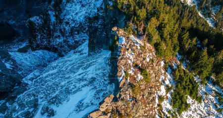 Photo for Rocky Mountain peak covered in Snow. Sunny Sunset. Aerial. British Columbia, Canada. - Royalty Free Image