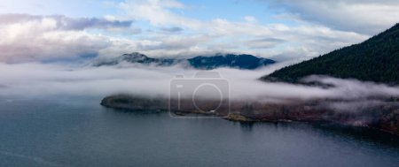 Photo for Howe Sound with Canadian Mountain Landscape Nature Aerial Background. Dramatic Cloudy Sky. BC, Canada. - Royalty Free Image