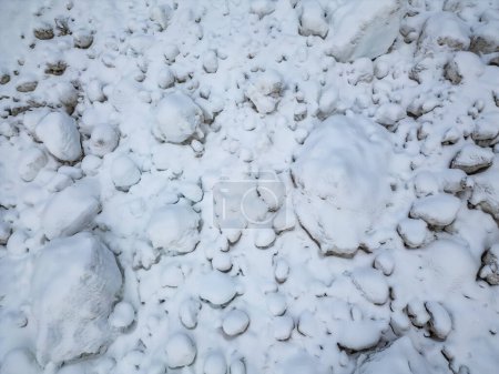 Rocks and Snow in Avalanche debris. Mountains in BC, Canada.
