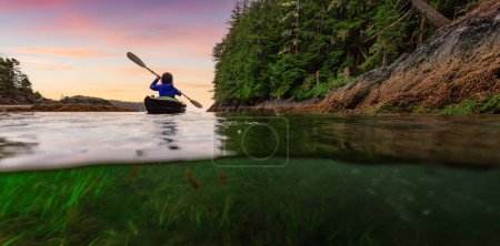 Photo for Adventure Woman Kayaking on West Coast of Pacific Ocean. Port Hardy, Vancouver Island, BC, Canada. - Royalty Free Image