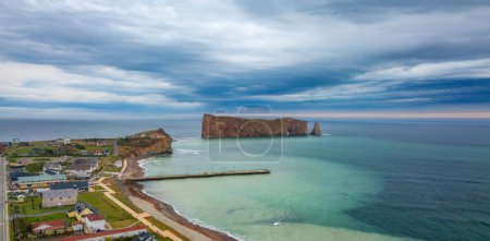 Photo for Town on the Atlantic Ocean Coast during a cloudy sunset. Perce, Quebec, Canada. Aerial Panorama - Royalty Free Image