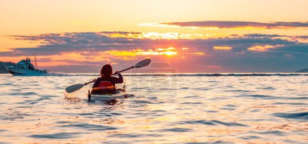 Photo for Kayaking at Colorful Sunset in Vancouver, BC, Canada. - Royalty Free Image