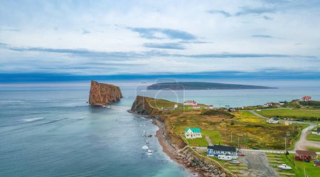 Photo for Town on the Atlantic Ocean Coast during a cloudy sunset. Perce, Quebec, Canada. Aerial Panorama - Royalty Free Image