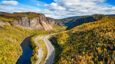Photo for Scenic road in Canadian Mountain Landscape Valley with River. Fall Season. Corner Brook, Newfoundland, Canada. - Royalty Free Image