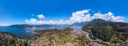 Aerial Panorama View of Howe Sound in West Vancouver, BC, Canada. Sunny Cloudy Day.