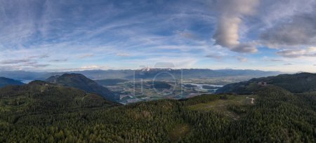 Aerial panorama of Canadian Mountain Landscape in Valley. Sunny Sunset. Fraser Valley, BC, Canada.