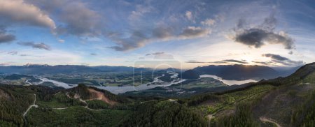 Aerial panorama of Canadian Mountain Landscape in Valley. Sunny Sunset. Fraser Valley, BC, Canada.