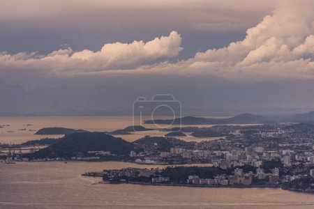 Photo for Beautiful view to bay water, buildings and sunset clouds in Rio de Janeiro, Brazil - Royalty Free Image