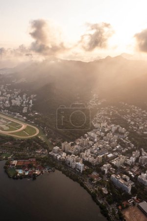Photo for Beautiful aerial view to city buildings, mountains and urban lagoon in Rio de Janeiro, Brazil - Royalty Free Image