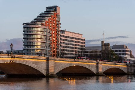 Photo for Beautiful view to old historic bridge over Thames River and modern buildings on the back in central London, England, UK - Royalty Free Image