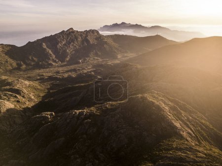 Photo for Beautiful aerial drone view to rocky mountains and altitude fields in Itatiaia National Park, Rio de Janeiro, Brazil - Royalty Free Image