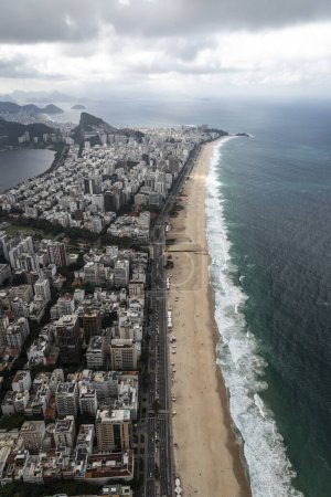 Photo for Beautiful aerial view to ocean beach and city buildings in Rio de Janeiro, Brazil - Royalty Free Image