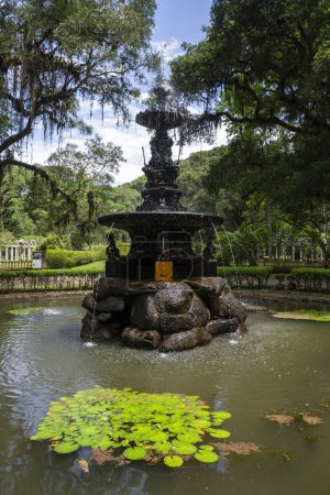 Photo for Beautiful view to black bronze water fountain in the Botanical Garden of Rio de Janeiro, Brazil - Royalty Free Image