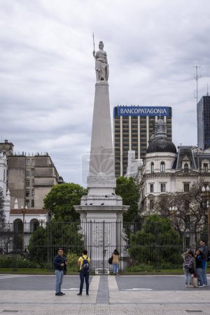 Photo for Beautiful view to white monument and historic buildings in Plaza de Mayo, central Buenos Aires, Argentina - Royalty Free Image