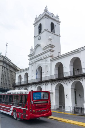 Photo for Beautiful view to historic white building and red bus in Plaza de Mayo, central Buenos Aires, Argentina - Royalty Free Image