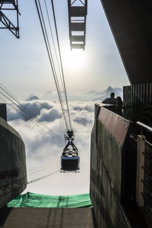 Photo for Beautiful view to Sugar Loaf Mountain cable car above the clouds in Rio de Janeiro, Brazil - Royalty Free Image