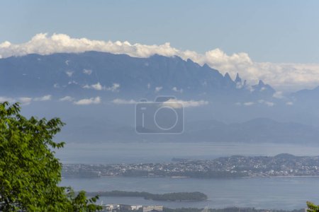 Photo for Beautiful view to city buildings from green rainforest mountain in Tijuca Park, Rio de Janeiro, Brazil - Royalty Free Image