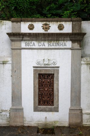 View to old historic Bica da Rainha water drinking fountain in Cosme Velho, Rio de Janeiro, Brazil