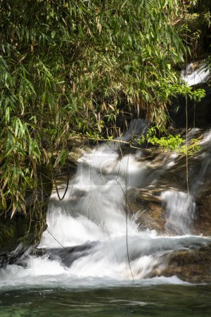 Beautiful waterfall with rocks and green rainforest, Serrinha do Alambari, Mantiqueira Mountains, Rio de Janeiro, Brazil