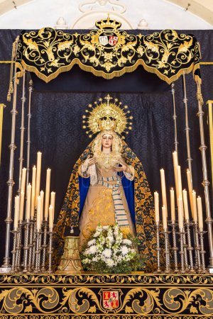 Photo for Huelva, Spain - January 22, 2023: Paso de Semana Santa (Platform or Throne) of Our Lady of Loneliness (Nuestra Senora de la Soledad) inside of the Hermitage of La Soledad - Royalty Free Image