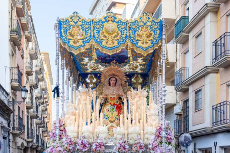 Photo for Holy Week Procession of the Paso (Platform or Throne) Our Lady of the Angels, Nuestra Senora de Los Angeles, through the streets of the city of Huelva, Andalusia, Spain, La Borriquita brotherhood - Royalty Free Image
