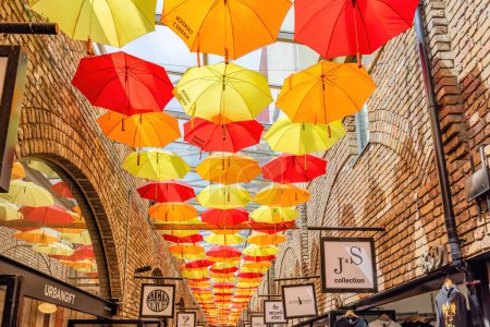 Photo for London, UK - May 23, 2023: colorful umbrellas hanging from the roof of the Camden Town market - Royalty Free Image