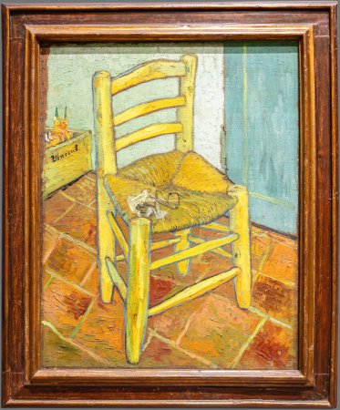 Photo for London, UK - May 2023: Van Gogh's Chair with Pipe. The painting shows a rustic wooden chair with a simple woven straw seat on a bare floor of terracotta tiles, Is one of Van Gogh most iconic images - Royalty Free Image