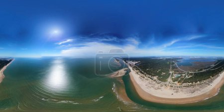 Aerial 360 degrees view of the Rompido Arrow (La Flecha del Rompido), a sand bank formed on the Rompido and Portil beaches that already reaches La Bota beach, in Punta Umbria, Huelva province