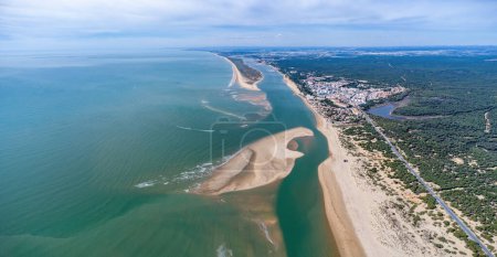 Aerial panoramic view of the Rompido Arrow (La Flecha del Rompido), a sand bank formed on the Rompido and Portil beaches that already reaches La Bota beach, in the municipality of Punta Umbria, Huelva