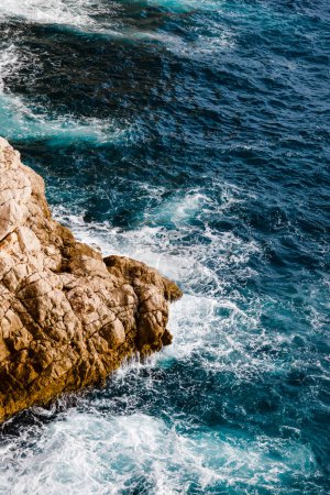 Photo for Water and rocks, top view of the Adriatic Sea in Dubrovnik, Croatia - Royalty Free Image