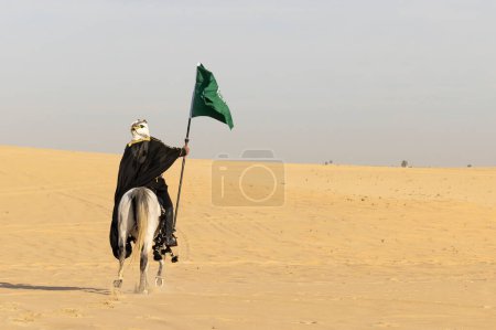 Photo for Saudi man in traditional clothing with his white stallion - Royalty Free Image