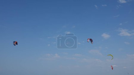 Photo for Kitesurf kite against clear sky. Kites flying in air scenic background.  Imbros Island. Gokceada, Canakkale Turkey 08.20.2022 - Royalty Free Image