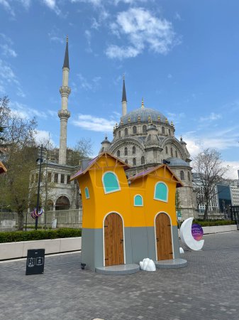 Photo for Istanbul, Turkey April 19, 2023 View of Tophane Clock Tower square during Ramadan, with the historical Nusretiye Mosque in the background - Royalty Free Image