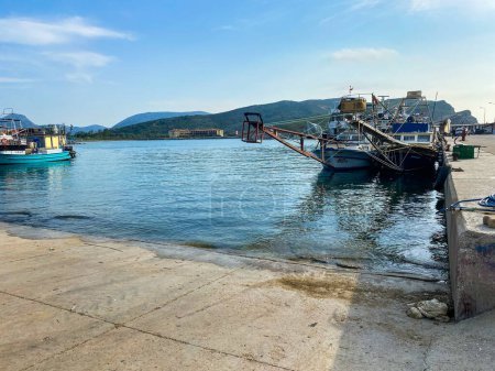 Photo for Gokceada, Canakkale, Turkey May 27, 2023 Kalekoy Harbor with moored swordfish ships. Kalekoy is the oldest port of Gokceada. - Royalty Free Image