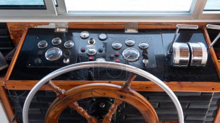 Photo for Steering wheel in the captain cabin of a big tour boat or ferry. Inside the captain's cabin. transportation and travel concept - Royalty Free Image