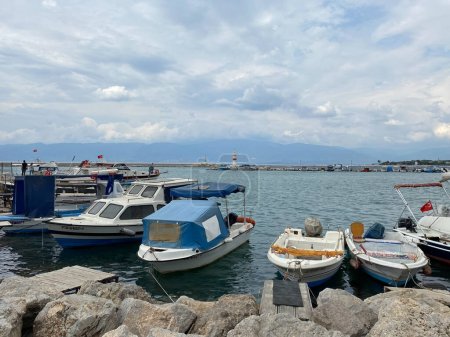 Photo for Burhaniye, Balikesir, Turkey October 15, 2023: Small port of Burhaniye with fishing boats. Burhaniye is a small fishing town and district of Balikesir Province in the Aegean region of Turkey - Royalty Free Image